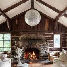 a living room filled with furniture and a fire place