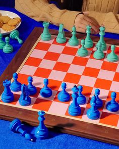 a person playing chess on a board game