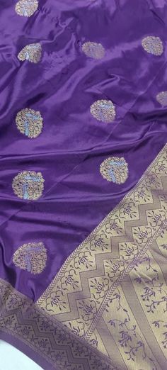 A beautiful aubergine Banarasi Silk saree - sarees that complete your ethnic look effortlessly. Banarasi sarees havr intensive weaving process, the use of premium Banarasi silk, intricate craftsmanship, and high demand for these exquisite sarees during special occasions. The rich shine and weaving makes them look royal.  This saree is perfect for all types of indian functions :- like- Pooja, Mehandi, wedding, etc Purple Art Silk Pre-draped Saree With Self Design, Traditional Purple Pre-draped Saree For Navratri, Traditional Purple Pre-draped Saree For Puja, Purple Pre-draped Saree For Puja, Purple Self-design Pre-draped Saree For Puja, Purple Pre-draped Saree For Wedding, Purple Katan Silk Pre-draped Saree With Zari Work, Purple Art Silk Pre-draped Saree For Navratri, Purple Paithani Silk Pre-draped Saree For Wedding