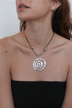 Corded necklace with swirl pendant, 16" & 2"Content + CareDo not get wetAvoid contact with lotions and fragrancesZinc Chunky Pendant Necklace, 2025 Moodboard, Thrift Board, Swirl Necklace, Chunky Jewellery, Corded Necklace, Antique Silver Necklace, Spiral Necklace, Oval Necklace