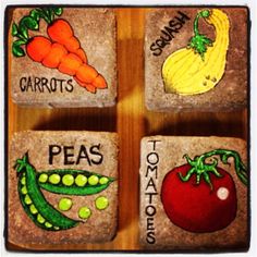 four rocks with different vegetables painted on them, one is for carrots and the other is for peas