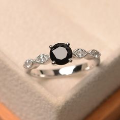 This halo ring features a 6mm round cut diopside and sterling silver finished with rhodium. Customization is available. It is made by hand, and it will take about 7 days to finish the ring after your payment is completed. Main stone: black spinel weight: Approx 0.93 ct Metal type: sterling silver finished with rhodium Accent stone: cz Customization is available, I also can make it with 14k solid gold (white or yellow or rose) and diamond accent stone, just feel free to contact me. Any question, Blue Gemstone Rings, Womens Ring, Womens Rings Fashion, Round Engagement Rings, Aquamarine Engagement Ring, Round Cut Engagement Rings, Ring Fashion