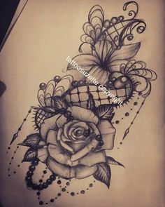 a black and white photo of a rose tattoo