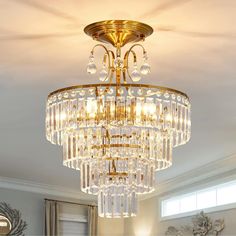 a chandelier hanging from the ceiling in a living room