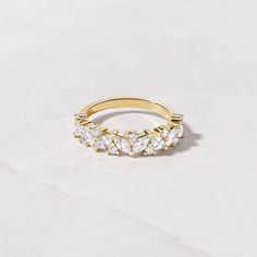 an image of a gold ring with diamonds