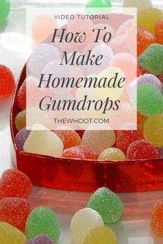 a bowl filled with gummy bears sitting on top of a table