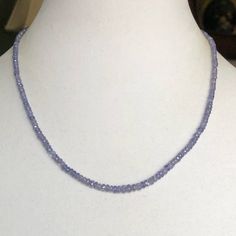 Hand Faceted Tanzanite Rondelle Beads 3-4mm (64.27 Cts) In Sterling Silver Closure Elegant Sapphire Faceted Beaded Necklaces, Elegant Tanzanite Jewelry With Faceted Beads, Sapphire Gemstone Rondelle Necklace, Sapphire Beaded Rondelle Jewelry, Elegant Tanzanite Gemstone Bead Necklaces, Elegant Tanzanite Gemstone Bead Necklace, Elegant Tanzanite Beaded Necklace, Faceted Sapphire Round Bead Necklaces, Blue Tanzanite Gemstone Beads Necklace