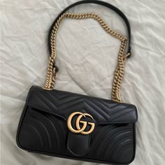 Gucci Gg Marmont Shoulder Bag In Black Has A Soft Structure Shape And An Oversized Flap Closure With Double G Hardware,With Sliding Chain Strap Can Be Worn Multiple Ways, Changing Between Shoulder And A Top Handle Bag. It Is An Authentic Italian Bag From Gucci Never Used!!! Its Brand New!!! Sac Gucci Marmont, Gg Gucci Bag, Luxury Coach Shoulder Bag For Fall, Luxury Brown Coach Saddle Bag, Gucci Marmont Black Hardware, Luxury Coach Clutch Shoulder Bag, Luxury Clutch Shoulder Bag By Coach, Luxury Coach Clutch For Everyday Use, Luxury Coach Elegant Clutch