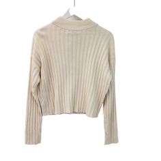 Beautiful cream color ribbed mock cropped sweater that is a great piece to wear alone or layer with a button down shirt underneath. Nice career piece or wear for a more casual day. NOTE that preloved pieces may have changed in size with wash and wear so please check approximate measurements for current size and fit.Size: Womens MApproximate Measurements Lying Flat: Bust 19.5 in Waist 19 in Length 19.5 inCondition: New With TagsAll pieces are stored in a smoke-free, pet-free environment. If flaws Cropped Sweater, Cream Color, Sweater Sizes, Madewell, Wool Blend, Button Down Shirt, Career, Size Medium, Pet