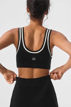 Cut from a softly textured cotton knit with a slew of preppy details, this bra top brings a touch of tenniscore to any look. It has a lightly supportive fit with tank straps, a classic scoop neck, and a scooped-low back. And as for that cute, contrasting trim? It pairs perfectly with the rest of the Tennis Club collection. Sporty Ribbed Scoop Neck Sports Bra, White Sporty Sports Bra For Everyday, Sporty White Sports Bra For Everyday, Sporty Black Sports Bra For Everyday, Sporty Everyday Crop Top With Seamless Construction, Sporty Seamless Alo Yoga Tops, Alo Yoga Sporty Seamless Tops, Alo Yoga Athleisure Bra-friendly Top, Alo Yoga Athleisure Bra Friendly Top