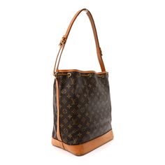 This is an authentic LOUIS VUITTON Monogram Noe. This classic bucket style shoulder bag is crafted of Louis Vuitton monogram coated canvas. The shoulder bag features vachetta cowhide leather including a solid base, an adjustable shoulder strap, and top cinch strap with polished brass hardware. This bag opens to a brown fabric interior. Noe Louis Vuitton, Louis Vuitton Noe Bag, Louis Vuitton Monogram Bag, Louis Vuitton Empreinte, Embroidered Monogram, Louis Vuitton Damier Azur, Monogram Bag, Louis Vuitton Shoulder Bag, Brown Fabric