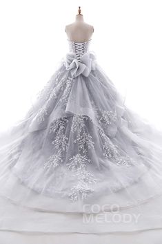 a white wedding dress on a mannequin