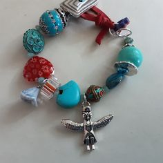 Southwestern style boho bracelet with Owl totem charm,  Turquoise Magnasite Zuni bear, red Millefiori heart, cane glass and rectangle silver button Silver Owl, Silver Buttons, Southwestern Style, Boho Bracelets, Favorite Jewelry, Jewelry Bracelets, Beaded Bracelets, Turquoise, Accessory Gift