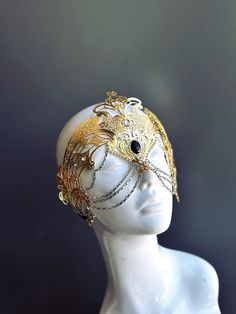 Step into the realm of goddesses with our women's masquerade mask in gold. Rhinestones delicately embellish the mask, adding a touch of sparkle. Silver chains gracefully adorn the mask, creating an enchanting movement. Capture attention at any masquerade party, ball, or themed event!


Age Group/Gender - Adult/Women

Size/Type - One size fits all adults

Mask Color - Gold

Mask Material - Laser Cut Metal

Special Features - Chains and rhinestones Masquerade Mask Women, Chain Mask, Metal Mask, Gold Mask, Laser Cut Metal, Masks Masquerade, Mask Shop, Masquerade Party, Silver Chains