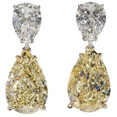 An impressive pair of diamond earrings! Each of the four diamonds are certified by GIA! 6.80 carats of Fancy Light Yellow diamonds, VS2. 2.01 carats of white, F color diamonds, SI1. 18k white and yellow gold Approximately .80 inches in length. Elegant and timeless these earrings were designed and made in New York. Tiny Diamond Earrings, Diamond Star Earrings, Yellow Diamond Earring, October Birthstone Jewelry, Fancy Light, White Diamond Earrings, Yellow Diamonds, Opal Earrings Stud, Opal Studs