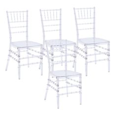 three white chairs with clear plastic seats