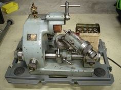 an old sewing machine sitting on top of a table