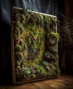 a moss covered frame sitting on top of a wooden floor