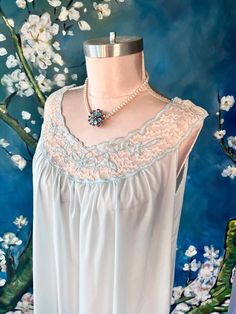 Vintage 70s Blue Pastel Floral Lace Empire Babydoll Lingerie Nightgown Slip Dress Boudoir ...would work as a maternity nursing lingerie, there are snaps at the shoulders for ease in nursing. by ALL size M please follow measurements for desired fit; measurements laying flat; armpit to armpit up to 23" waist up to 28" hip up to 29' top shoulder to bottom hem edge 45" fabric 30% polyester, 15% silk , 55% (cant read) Excellent Vintage Condition **pearl flower necklace is for display only, not for sa Vintage Sheer Sleepwear For Night, Sheer Blue Nightgown For Bedtime, Vintage Blue Wedding Nightgown, Blue Vintage Wedding Nightgown, Sheer Sleeveless Coquette Nightgown, Blue Sheer Sleeveless Nightgown, Vintage Blue Sheer Sleepwear, Blue Sheer Vintage Sleepwear, Vintage Camisole Sleepwear For Bedtime