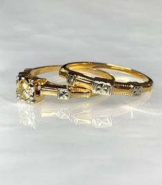 two yellow gold wedding rings with diamond accents