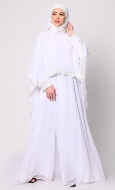 Step into the realm of elegance and sophistication with our stunning 3-piece ensemble, meticulously crafted to redefine your style with grace and beauty. The focal point of this ensemble is the Abaya, featuring a delicately embroidered border that adds a touch of regal charm to its classic silhouette. This Abaya,  Acco White Embroidered Dress With Cape Sleeves, Traditional Drape Abaya With Resham Embroidery, White Traditional Dress With Cape Sleeves, White Kaftan With Dupatta For Wedding, Elegant Long Abaya With Resham Embroidery, Wedding Chikankari Embroidery Set With Cape Sleeves, Elegant Abaya With Traditional Drape, Elegant Gown With Cape Sleeves For Eid, Elegant Abaya With Dabka Work