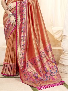 Elevate your traditional wardrobe with our fascinating orange zari weaving silk traditional paithani saree. This stunning saree features intricate zari weaving work that adds a touch of elegance to the vibrant orange silk fabric. The saree comes with a matching pink silk blouse also embellished with zari weaving work, adding a cohesive and stylish touch to your ensemble.
The 5.50 meters saree and unstitched blouse material allow for customization to ensure the perfect fit for any occasion. The c Traditional Wardrobe, Pink Silk Blouse, Paithani Saree, Beautiful Color Combinations, Blouse Material, Silk Material, Vibrant Orange, Beautiful Saree, Pink Silk