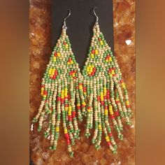 Artisan Boho/Bohemian Seed Beaded Beads Dangle/Dangly Silver French Hook Earrings With Colors Of Green/Red/Yellow/Pearl/White Big/Long/Large Diamond/Triangle Shape/Shaped Drop/Tassel/Tassels Statement Earrings Hippy/Hippie/Indian/Native American/Anthropologie/Free People Style/Design/Theme New With Tags Measures Approximately 4.5" Long At Its Longest Length And 1.25" Wide At Its Widest Width. Beautiful Handmade Artisan Earrings! Colors Of Green, French Hook Earrings, Yellow Pearl, Beaded Beads, Free People Style, Design Theme, Artisan Earrings, Triangle Shape, Beaded Dangles