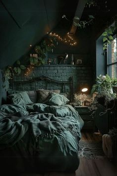 an attic bedroom with brick walls, green bedding and string lights on the ceiling