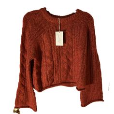 Elevate your winter and fall wardrobe with this Universal Thread from Target Women's Cable Knit Crewneck Sweater. The tag says the color is red BUT this is not a true red. More of a brownish oranges red. The sweater features a beautiful loose cable-knit pattern with bell sleeves and a rolled hemline for a chic and modern touch. The warm cozy soft heavyweight sweater is made of a knit fabric of polyester and acrylic, making it comfortable to wear while keeping you warm in colder weather. Raglan sleeve with bell and rolled cuffs. Oversized. This sweater is perfect for casual occasions and can be styled with jeans and sneakers. The sweater is machine washable, and the size is regular fit. MSRP $30 Please follow as I add additional women’s sweaters in various sizes, styles, and colors separate True Red, Knit Crewneck, Knit Pattern, Universal Thread, Office Outfits, Fall Wardrobe, Crewneck Sweater, Red Sweaters, Knit Patterns