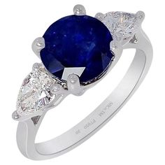 New Platinum custom natural Ceylon sapphire ring containing a round cut natural blue sapphire measuring 7.79 x 7.88 x 5.94 mm weighing 3.05 carat. Type II. medium-dark, strong, blue color GIA B 6/5, set with 2 pear-cut diamonds with a weight 0.30 ct's each VS-2 clarity, E color. Please see the videos & GIA sapphire & diamond reports shown with the pictures. This is a classic 3 stone natural sapphire ring set with a 3.05 ct bright blue round cut sapphire set with two GIA certified pear cut diamonds at each side with outstanding brilliance creating this stunning custom ring platinum 3 stone ring setting. This custom sapphire ring would be a perfect choice for both engagement ring or special anniversary gift, please contact us with any questions, our office is open every day and are always ha Platinum Sapphire Ring, Royal Engagement Rings, Blue Sapphire Engagement Rings, Ceylon Sapphire Ring, Saphir Ring, Sapphire Engagement Rings, Platinum Diamond Rings, 3 Stone Rings, Ceylon Sapphire