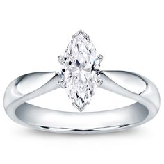 a white gold ring with an oval cut diamond