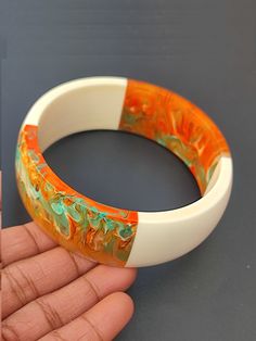 you will receive 1 piece of Resin Jewelry Trends Multi Color Bangle wide Bracelet Resin Art Purely Handcrafted Exclusive Stacking Bohemian Unique Vintage Style Jewelry Inner diameter: 2.6 inches  Thank you very much for visiting! Any questions, please feel free to contact us. Discount for bulk provide. Unique White Bracelets For Festivals, White Handmade Bohemian Bangle, Handmade White Cuff Bracelet For Festival, White Adjustable Bangle With Unique Style, Orange Bohemian Bangle Bracelet, Unique Adjustable White Bangle, Bohemian Orange Bangle Bracelet, Handmade Artisan Bangle, Handmade Orange Cuff Bracelet Gift