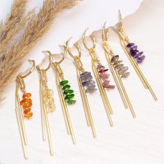 Raw Crystal Bar Drop Hoops, Colorful Birthstone Earrings Gift Daughter or Friend, Beaded Tassel Dangle Huggie Hoops, Long Bar Charm Huggies ✨ These earrings feature a beaded bar of genuine raw crystals & a 2-bar charm hanging from a dainty huggie hoop. Available in Gold finish. ✨ The simplicity of these earrings make them ideal gifts. They are lightweight and easy to match with your wedding color palette! Understated yet elegant, they can be paired with virtually any style of dress. PLEASE NOTE: These earrings are sold as SINGLES (1 Hoop total) or as PAIRS (2 Hoops total) --> Stacking Charm Hoops Available to Purchase HERE: https://www.etsy.com/listing/1522629950/ H O W ∙ T O ∙ O R D E R 1st DROP DOWN menu: * Select the GEMSTONE OPTION you would like 2nd DROP DOWN menu: * Select if you wou Clay Inspo, Bridesmaids Earrings, Quilling Work, Raw Crystals, Earrings Diy, Birthstone Earrings, Small Charms, Long Dangle Earrings, Birthstone Gifts