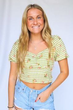 Add some flower power to your wardrobe with the Garden Party Top! This playful smock top features a green gingham pattern and charming flower accents. The cropped, puff style adds a touch of whimsy to any outfit, making it perfect for a garden party or any casual occasion. Green Gingham, Gingham Pattern, Smock Top, Outfit Making, Hair Accessories Jewelry, Party Tops, Bridal Collection, Garden Party, A Garden