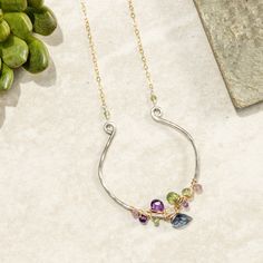 This beautiful silver pendant is shaped like an open petal and features gold wraps and gemstone clusters for a unique look. It's sure to become your favorite piece of bling!Complete with our signature handcrafted tension "S" clasp closure. Perfect for anyone that struggles with solo-clasping a lobster or spring ring clasp. Extenders can be clasped anywhere from 16"-18"+++Metal: 14k Gold filled and sterling silverGemstones: Fluorite, amethyst, pink amethyst, green amethyst, and green apatiteDimen Modern Twist Silver Teardrop Jewelry, Modern Twist Dangle Jewelry For Gifts, Modern Twist Jewelry With Gemstone For Gift, Teardrop Multi-stone Jewelry Making Supplies, Metal Jewelry With Gemstone Accents For Gifts, Elegant Freeform Wire Wrapped Jewelry, Gift Jewelry With Gemstone Accents, Elegant Freeform Gemstone Jewelry, Fusion Style Birthstone Pendant Jewelry