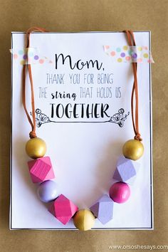 a mother's day card with a wooden bead necklace