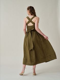 "Summer calls for a crisp dress and this cross-back dress from Linennaive is pretty perfect.  Made from breezy linen, it has comfortable cross back that'll really let skin breathe. Featuring a a classic square neckline and pleated detailing, evoking the laidback rhythms of far-off islands and unexplored landscapes.  It enhance the grace and femininity with a whimsical and flattering flow.  PS: It show very gorgeous and rich colors in sunlight for a truly one-of-a-kind, sophisticated allure. 【Fabric】 100% Linen, around 200g/gram. Medium weight. Every year we have a dedicated team to study the evolution of linen. Linen is a traditional fabric. It seems that linen will not change even if dynasties have changed, and time has passed. Let us add a little imagination and curiosity here. If the ra Tie-back Midi Dresses For Garden Party, Tie Back Midi Dress For Garden Party, Midi Length Tie Back Dress For Garden Party, Elegant Square Neck Picnic Dress, Fitted Cross Back Spring Dresses, Fitted Cross-back Spring Dresses, Knee-length Midi Dress With Tie Back For Garden Party, Knee-length Tie Back Midi Dress For Garden Party, Green Midi-length Dress With Tie Back