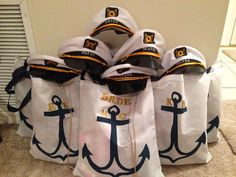 several bags with hats and anchor on them