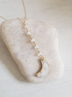 The Moon is symbolic of changes....the seasons, the tides and life. Wear this unique center drop necklace as a reminder to embrace the changes in your life. ONLY ONE LEFT! Natural moonstones are hand wire wrapped with gold fill wire and joined to a beautiful white druzy crystal crescent moon creating a dramatic center drop pendant. Shimmering Gold Fill chain drapes your neck. Solid lobster clasp. What is Druzy? Druzy is naturally formed crystals on top of another mineral/rock and is completely u Bohemian Moon Crystal Necklace Gift, Bohemian Crystal Necklace With Moon Charm, Bohemian Moon-shaped Necklaces With Natural Stones, Bohemian Moon-shaped Crystal Necklace Gift, Spiritual Moon-shaped Gemstone Necklace, Y Necklace, Citrine Necklace, Druzy Crystal, Witchy Jewelry