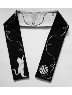 a black and white scarf with a dog on it