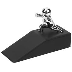 a silver figurine holding a baseball bat on top of a black base with a white background