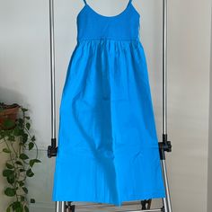 Midi Dress With Spaghetti Straps Blue Sundress Midi Dress, Cotton Midi Dress With Spaghetti Straps For Brunch, Blue Sundress With Adjustable Straps For Spring, Light Blue Midi Length Sundress, Blue Midi Sundress For Beach, Blue Cotton Midi Dress For Daywear, Cotton Midi Dress With Adjustable Straps For Brunch, Blue Spaghetti Strap Dress For Casual Wear, Blue Spaghetti Strap Casual Dress