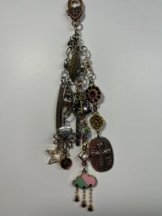 an assortment of charms hanging from a chain