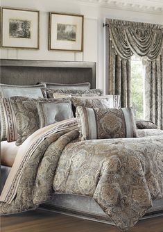 the comforter and bedding is made in an elegant style with paisley patterns on it