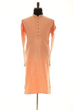 Grab this Stylejastic Peach-readymade kurta in Brocade silk enhanced with Loops Buttons on placket following Motifs (Booti) pattern fabric. *Featuring a mandarin collar *Unlined  *full sleeves, both side pockets, and & Stylish buttons placket. * Length = 47 inches from High point of Shoulder to Hem Accompanied by cotton silk pants in golden beige color. Do Note: All Accessories shown are for styling purposes only. Embroidery Lace and Buttons are a part of adornment and they can vary in design. Slight color variation may occur due to photographic reasons. Measurement variation up to 1 inch is possible. Orange Kurta With Cutdana For Eid, Transitional Orange Zari Work Kurta, Orange Cutdana Kurta For Eid, Orange Cutdana Churidar For Eid, Pink Chanderi Long Sleeve Sherwani, Orange Cutdana Churidar For Festivals, Transitional Orange Straight Kurta Sets, Orange Semi-stitched Kurta With Pallu, Orange Traditional Wear For Festive Transitional Season