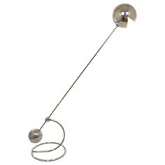 a metal object with two balls attached to it's end, on a white background