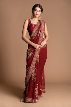 Red pre-stitched saree with multi-color floral motif embroidery. Comes with sleeveless blouse.
Component: 2
Embroidered
Neckline: U Neck
Sleeve Length: Sleeveless
Fabric: Viscose Georgette
Color: Red, Maroon
Pre-draped saree - Aza Fashions Sari India, Lehenga Inspiration, Maroon Saree, Fancy Sarees Party Wear, Drape Saree, Red Saree, Saree Trends, Wedding Saree, Stylish Sarees