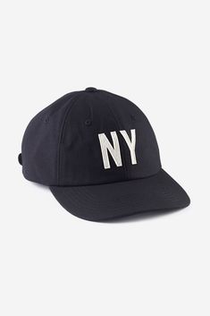 Rep New York your way in this 100% cotton cap. Constructed with a low profile and hand stitched felt lettering. Designed to make you feel sporty and sophisticated at the same time. 100% breathable cotton construction Hand Stitched Felt Lettering Brass closure Leather adjustable strap Unisex Cotton Baseball Cap With Embroidered Logo And Flat Brim, Sporty Six-panel Trucker Hat With Embroidered Logo, Sporty Six-panel Hat With Embroidered Logo, Cotton Fitted Hat With Letter Print, Curved Visor, Cotton Fitted Hat With Letter Print And Curved Visor, Urban Dad Hat With Embroidered Logo, Sporty Cotton Baseball Cap With Logo Patch, Sporty Six-panel Fitted Hat With Embroidered Logo, Cotton Fitted Hat With Embroidered Logo For Baseball Season