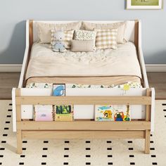 a child's bed with books on the bottom shelf