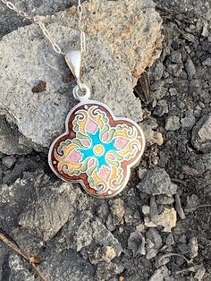 "Enamel Cross Cloisonne Necklace Handmade Religious Fine Sterling Silver Pendant Handmade by me and my 19 year old son in our beautiful Kansas City studio. See our work and follow us on Instagram please. Questions and comments are welcome. Get free shipping when you become our follower. Instagram: https://www.instagram.com/anaraandco/ Tiny fine silver wires bent according the design and then filled with Japanese glass enamel and fired numerous times in the kiln at 1500 degree F. Grinded with dia Bohemian Sterling Silver Flower Necklace, Handmade Brown Flower Jewelry, Sterling Silver Brown Round Pendant Necklace, Brown Sterling Silver Round Pendant Necklace, Brown Flower-shaped Jewelry Gift, Handmade Brown Flower Pendant Jewelry, Artisan Multicolor Medallion Jewelry, Handmade Artisan Sterling Silver Necklace, Handmade Artisan Sterling Silver Custom Necklace